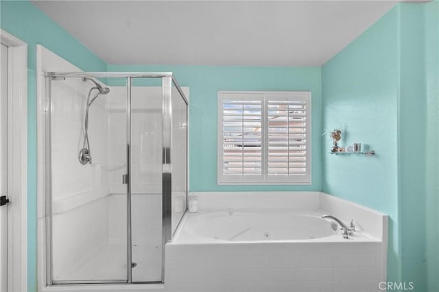 bathroom with separate shower and tub