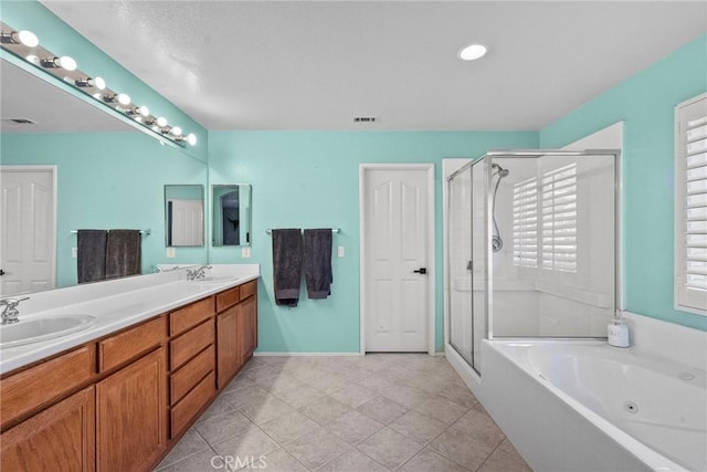 bathroom with separate shower and tub, vanity, and tile patterned flooring