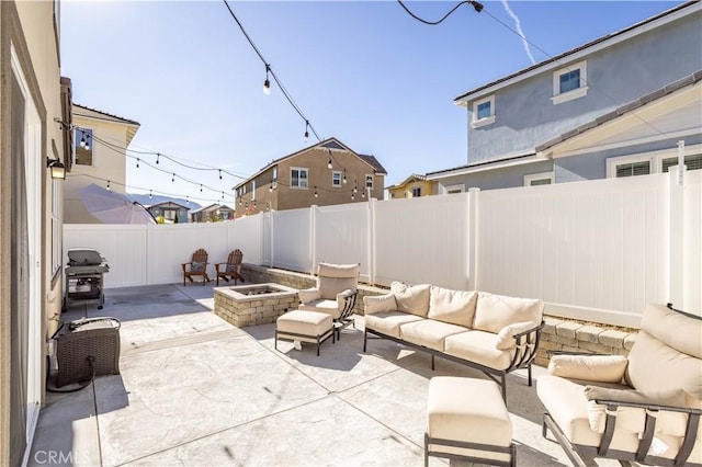 view of patio featuring an outdoor living space with a fire pit and a grill