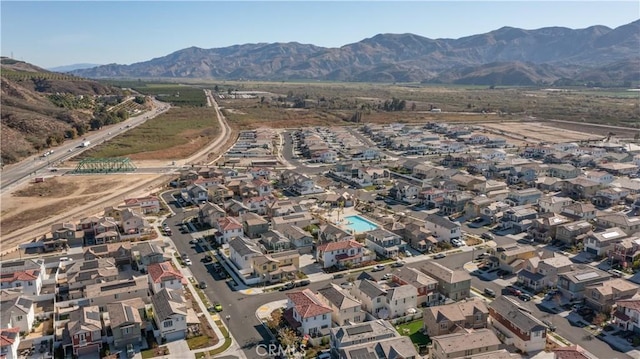 birds eye view of property with a mountain view