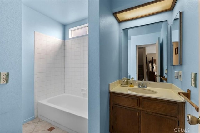 bathroom with tile patterned floors, vanity, and bathtub / shower combination