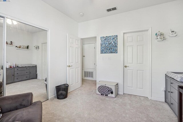 interior space featuring light colored carpet