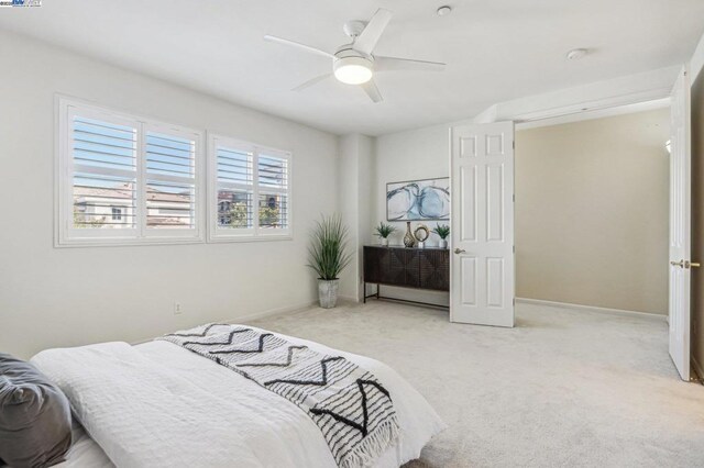 carpeted bedroom featuring ceiling fan