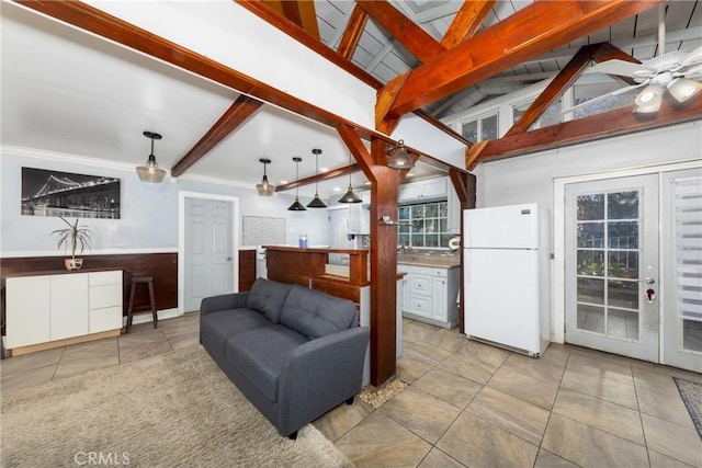 living room with lofted ceiling with beams