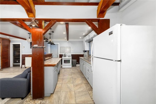 kitchen with decorative light fixtures, beamed ceiling, white appliances, white cabinetry, and wood counters