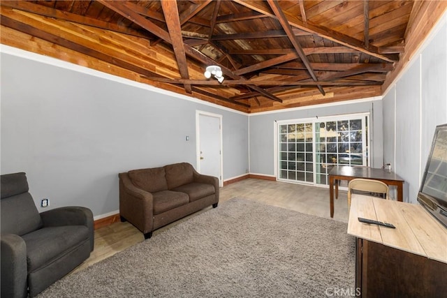 living room featuring lofted ceiling with beams and wooden ceiling