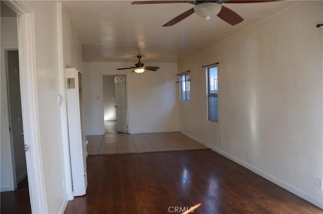 unfurnished room with ceiling fan and hardwood / wood-style flooring