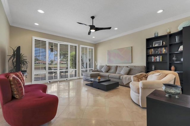 living room featuring ceiling fan, light tile patterned floors, and ornamental molding