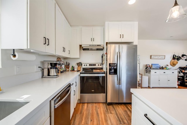 kitchen featuring light hardwood / wood-style floors, white cabinets, and stainless steel appliances