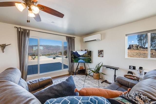 living room with ceiling fan, a wall mounted AC, and hardwood / wood-style floors