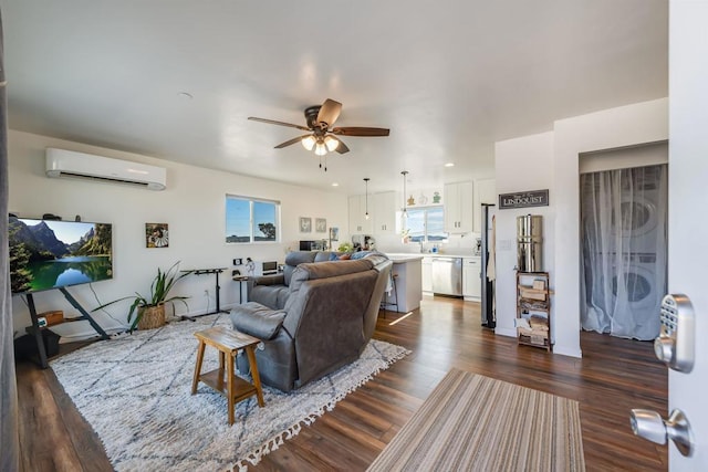 living room with ceiling fan, dark hardwood / wood-style floors, and a wall mounted air conditioner