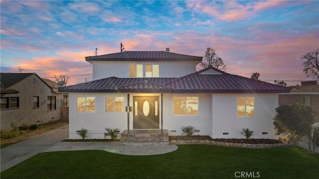 view of front of home with a lawn