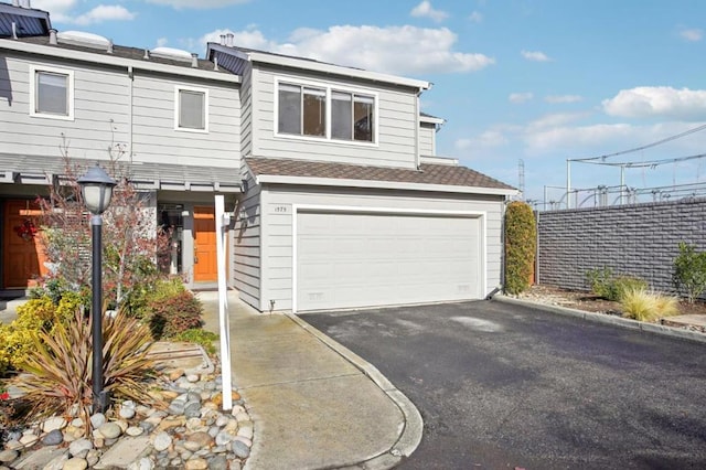 front of property with a garage