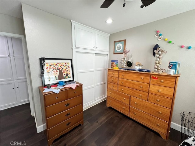 bedroom with ceiling fan, a closet, and dark hardwood / wood-style floors