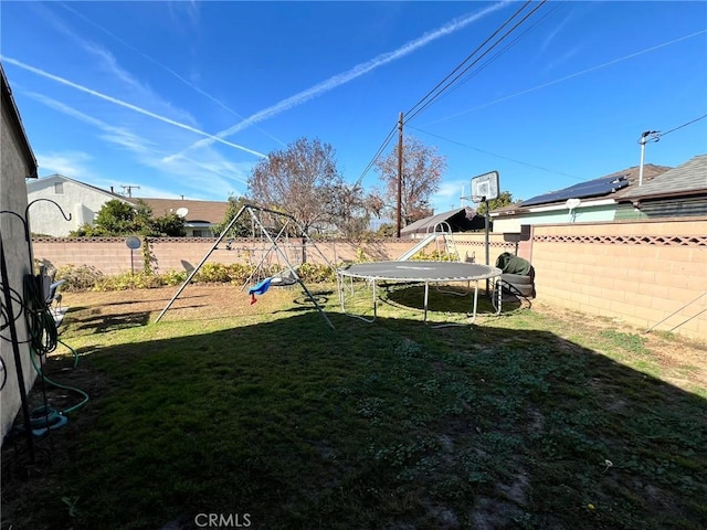 view of yard featuring a trampoline