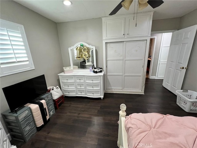 bedroom featuring ceiling fan and dark wood-type flooring