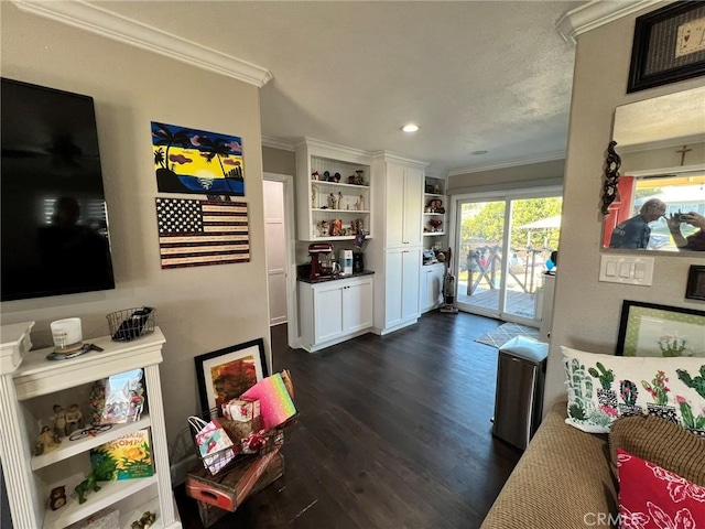 living room with dark wood-type flooring and ornamental molding