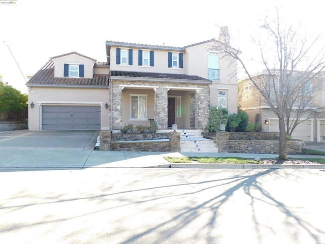 view of front of house with covered porch and a garage