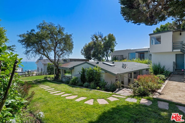 view of yard with a water view