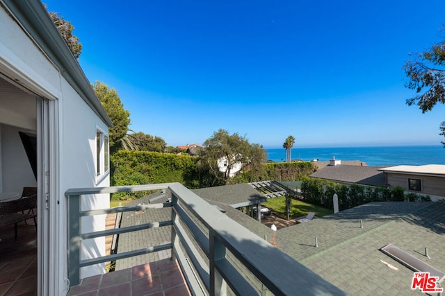 balcony featuring a water view