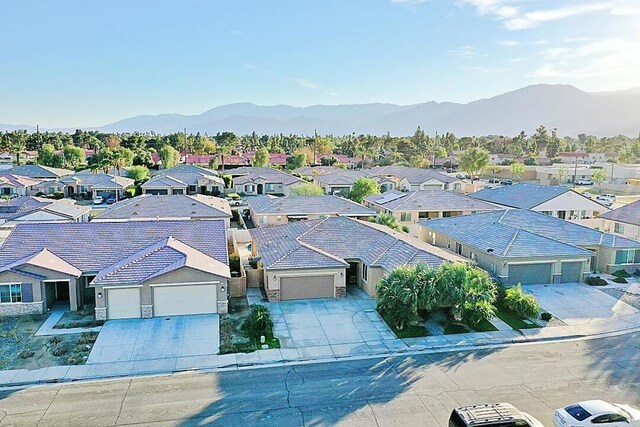 birds eye view of property featuring a mountain view