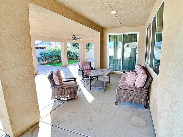 view of patio featuring ceiling fan and an outdoor living space