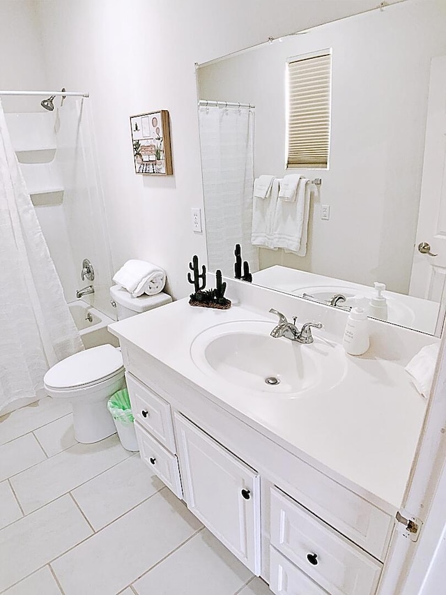 full bathroom featuring toilet, tile patterned floors, vanity, and shower / bathtub combination with curtain