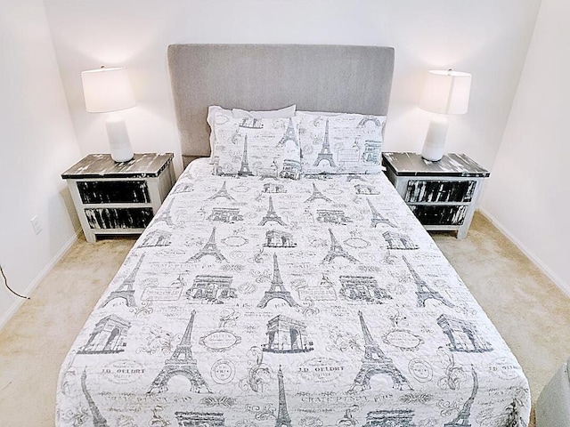 bedroom featuring light colored carpet