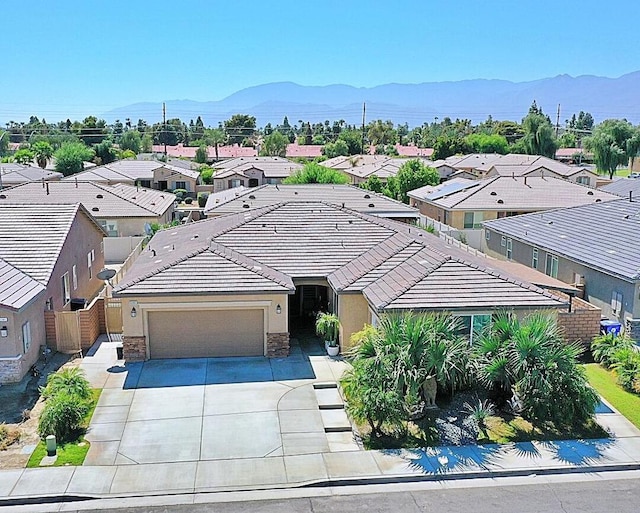 birds eye view of property featuring a mountain view