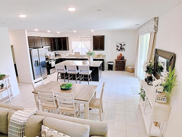 tiled dining area featuring sink