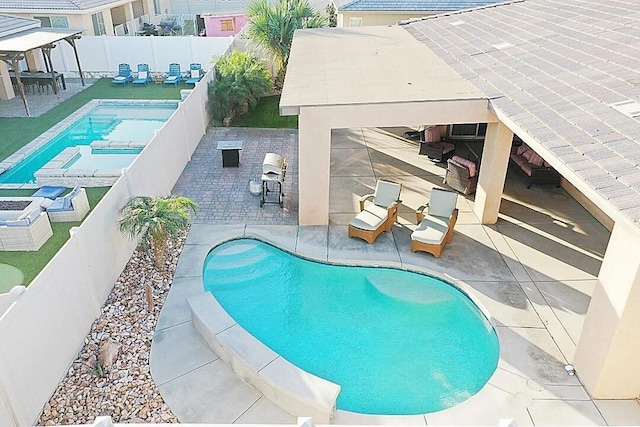 view of pool with a patio area and a gazebo