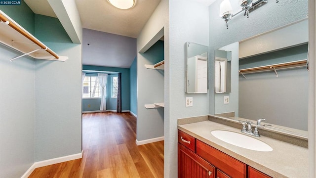 bathroom featuring vanity and hardwood / wood-style flooring