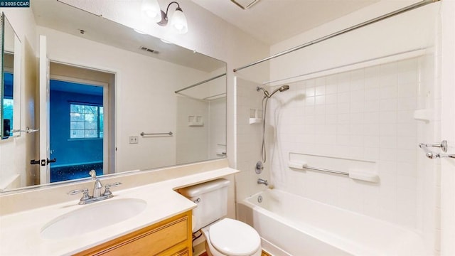 full bathroom with toilet, vanity, and  shower combination