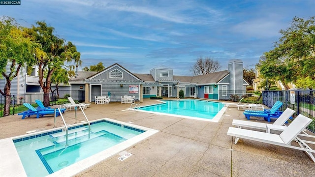 view of pool with a pergola, a patio area, and a community hot tub