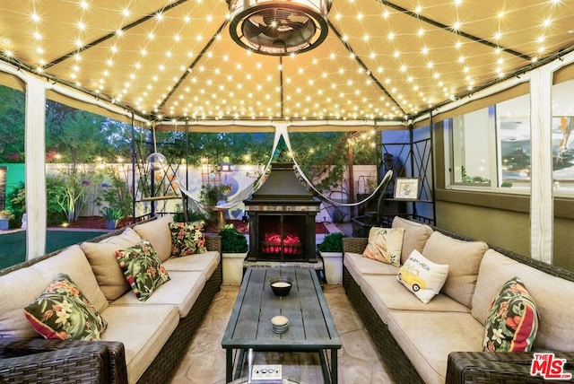 view of patio / terrace with outdoor lounge area and a gazebo