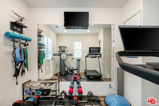 exercise area with hardwood / wood-style floors