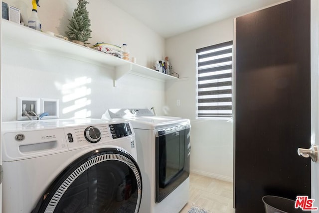 laundry area featuring separate washer and dryer