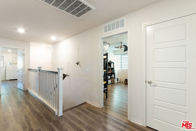 corridor featuring dark hardwood / wood-style flooring