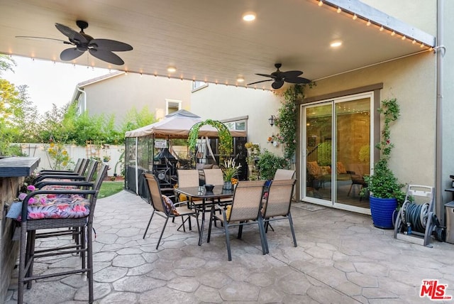 view of patio / terrace featuring ceiling fan