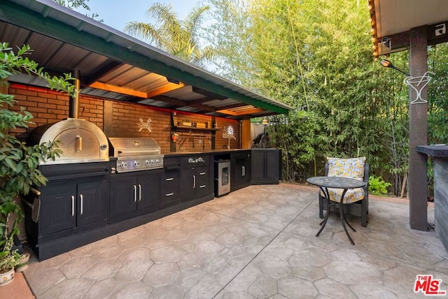 view of patio / terrace featuring area for grilling and grilling area