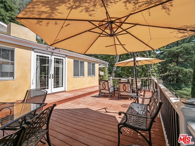 wooden deck featuring french doors