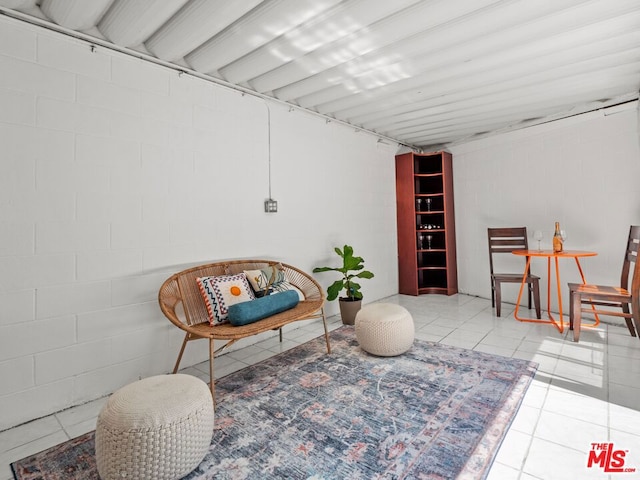 living area with light tile patterned floors