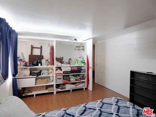 bedroom featuring dark wood-type flooring