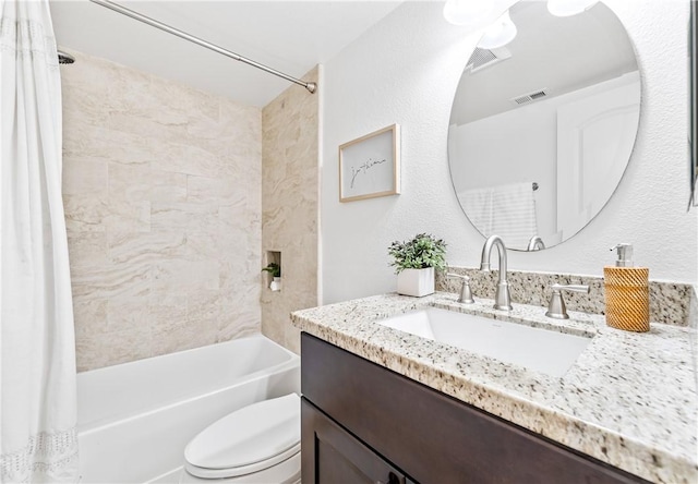 full bathroom with toilet, vanity, and shower / tub combo with curtain