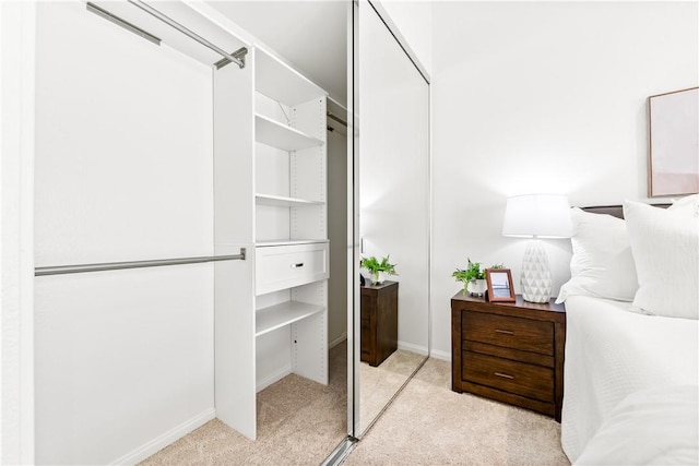 carpeted bedroom featuring a closet