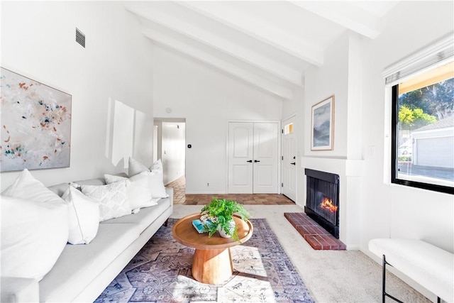 living room featuring carpet floors, high vaulted ceiling, beamed ceiling, and a fireplace