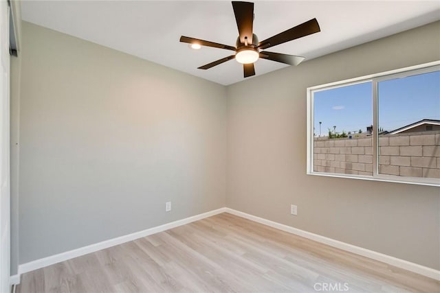 unfurnished room with ceiling fan and light hardwood / wood-style flooring