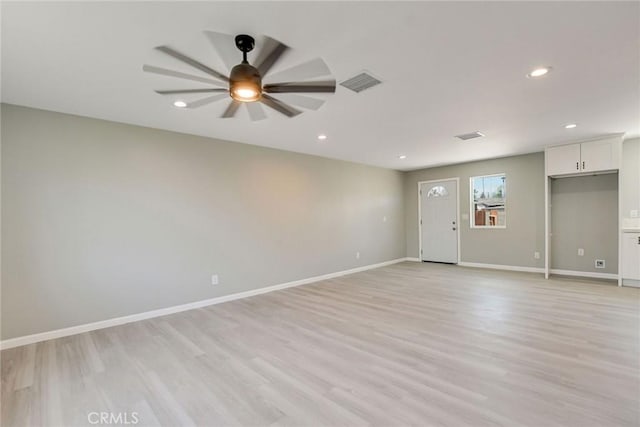 unfurnished room featuring ceiling fan and light wood-type flooring