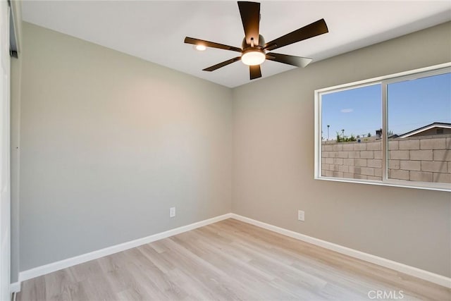 spare room featuring ceiling fan and light wood-type flooring