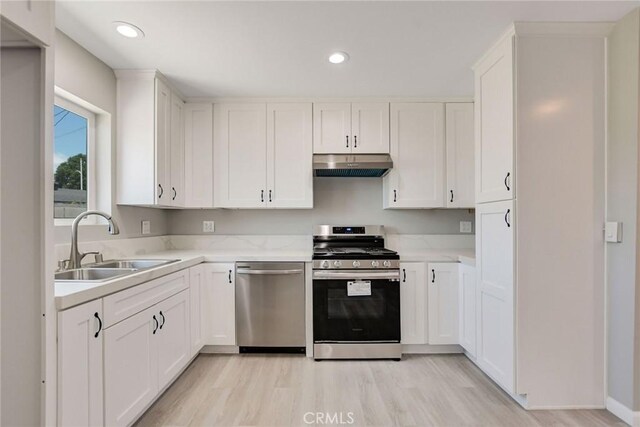 kitchen featuring white cabinets, sink, and stainless steel appliances